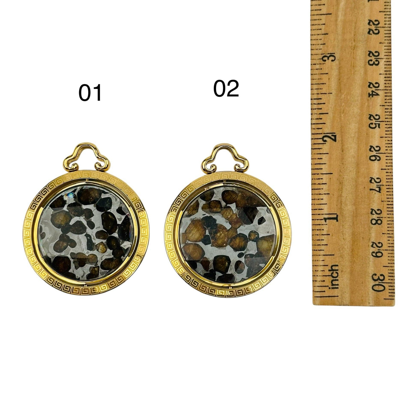 crystal pendants displayed next to a ruler for size refence 