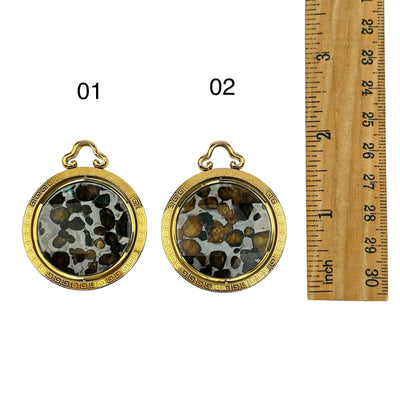 crystal pendants displayed next to a ruler for size refence 