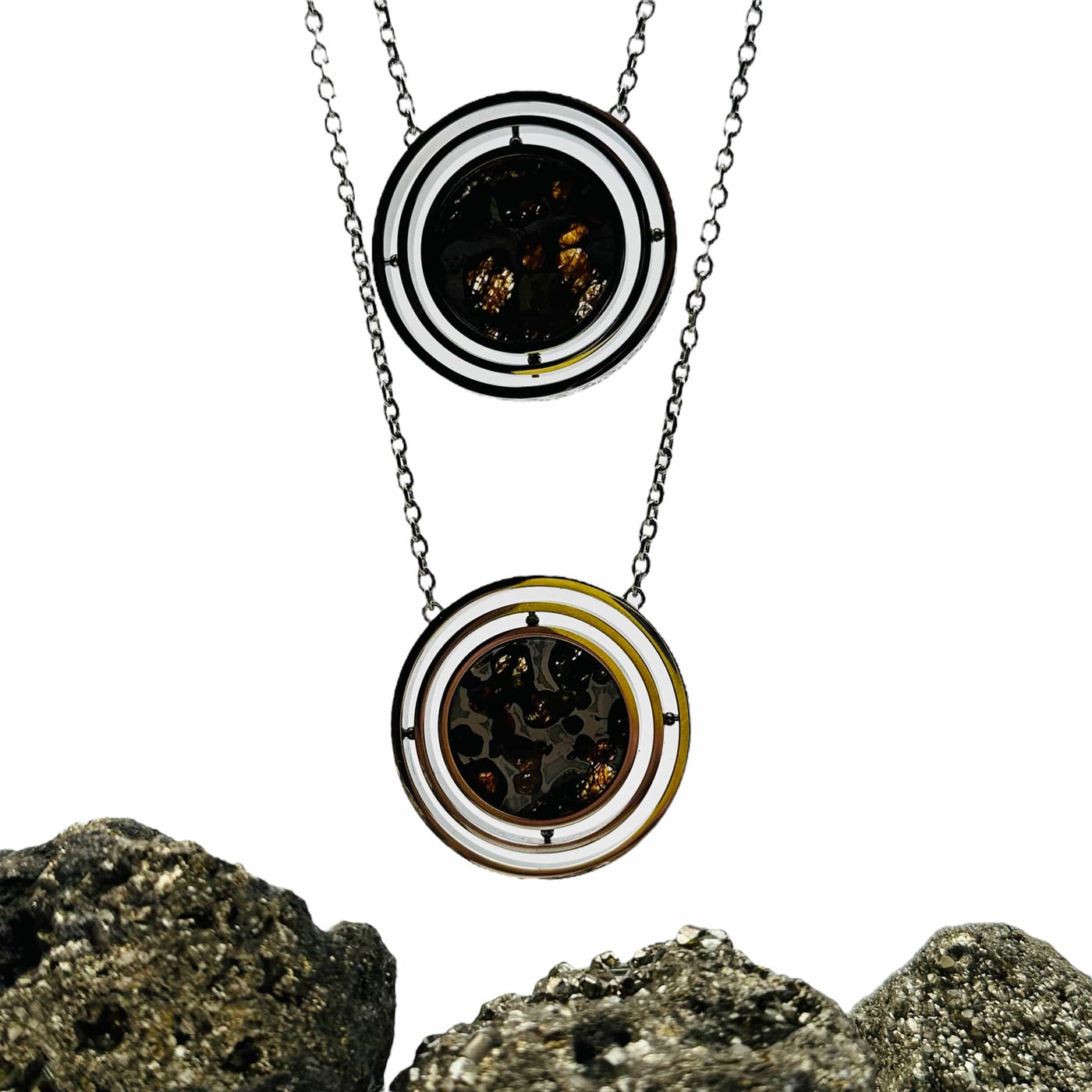 Sericho Pallasaite Meteorite Silver Necklaces displayed to show the differences in the patterns 