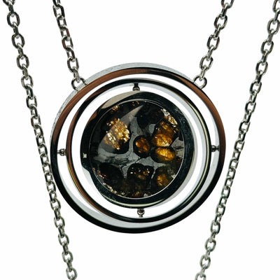 close up of the details on this meteorite pendant 