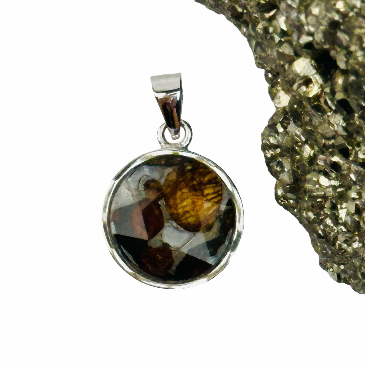 close up of the details on this meteorite pendant 