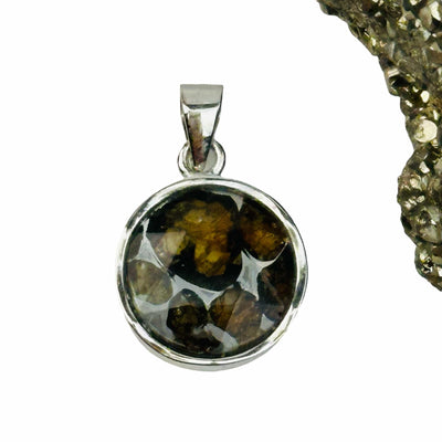 close up of the details on this meteorite pendant 