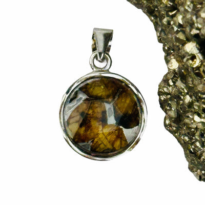 close up of the details on this meteorite pendant 