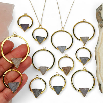 druzy triangle hoop pendants in hand for size reference 