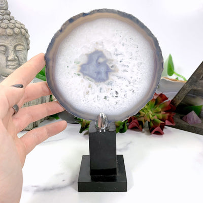 Agate on Wood Display Stand  with a hand for size reference