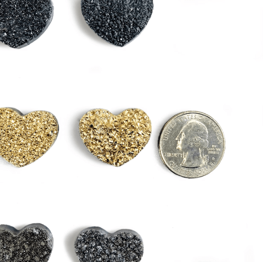 Titanium Druzy Heart Cabochons next to a quarter for size reference 