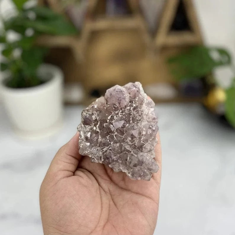 Amethyst With Calcite Formation in a hand
