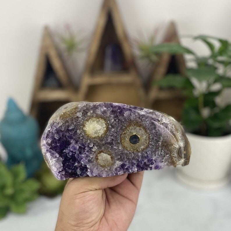 Amethyst Stalactite Freeform Cut Base Crystal in a hand for size reference