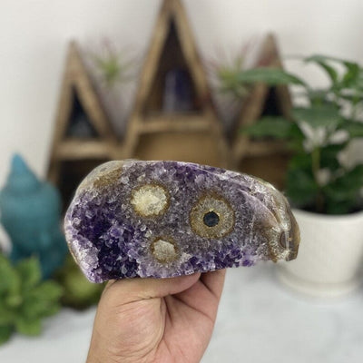 Amethyst Stalactite Freeform Cut Base Crystal in a hand for size reference