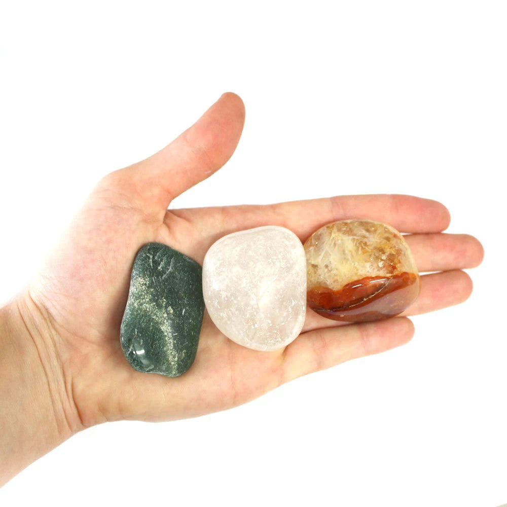 1 kg Mixed Natural Tumbled Gemstones Bag  three stones in hand for size reference