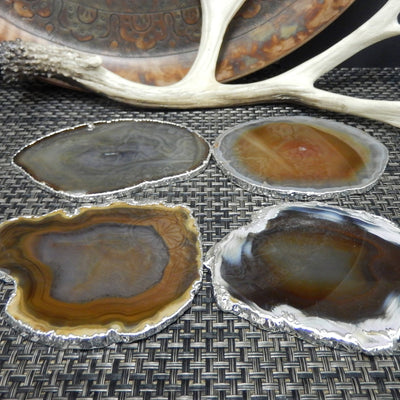 4 brown/black agate coasters with silver electroplate edging side view to shoe  thickness