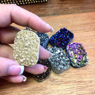  Mystic Druzy  Freeform Crystal Pendants shown with 1 in a hand for size reference