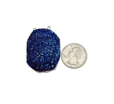 Crystal Freeform Mystic Druzy Double Bail Pendant with Electroplated Silver Edge next to a quarter for size reference