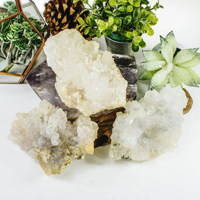 amethyst cluster with decorations in the background