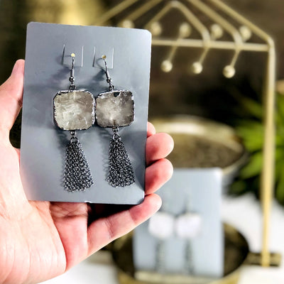 earrings with decorations in the background