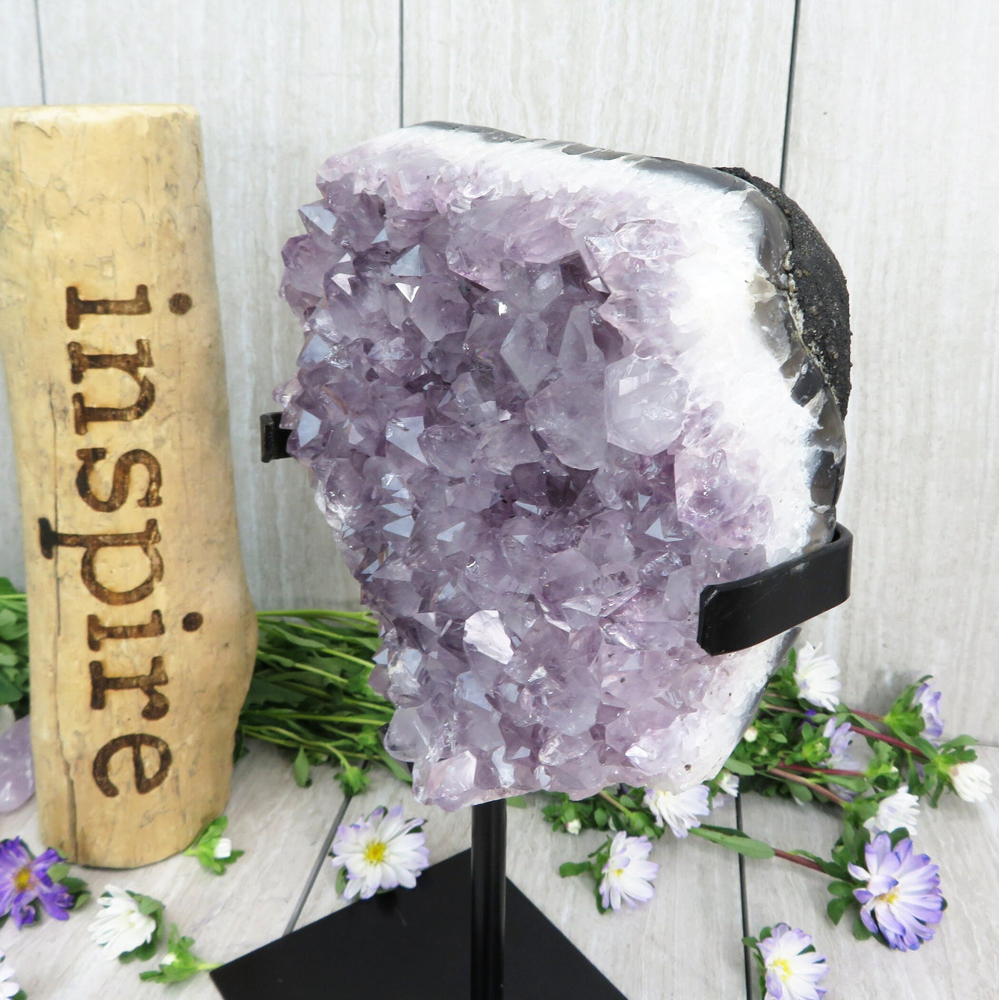 amethyst on stand with decorations in the background