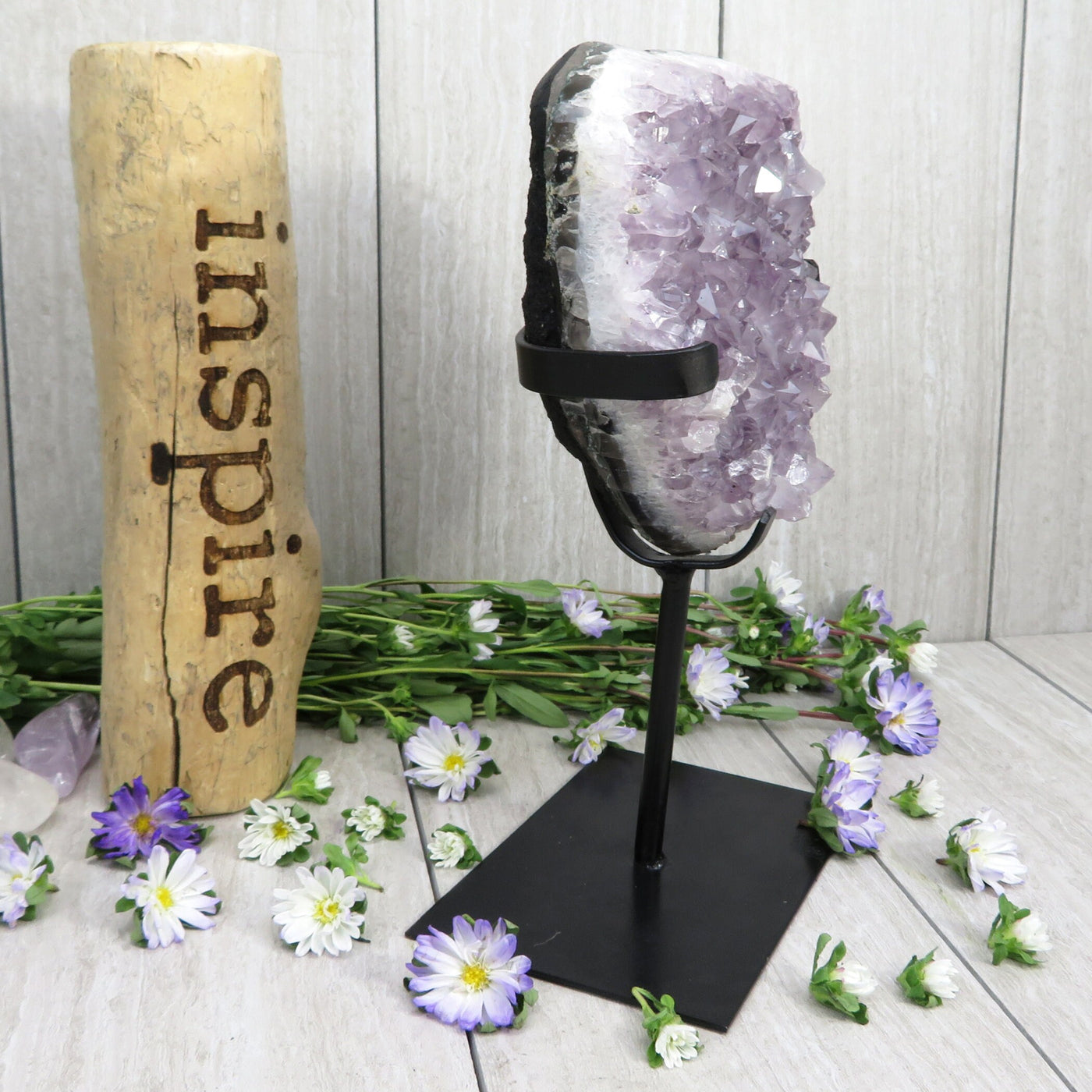 amethyst on stand with decorations in the background