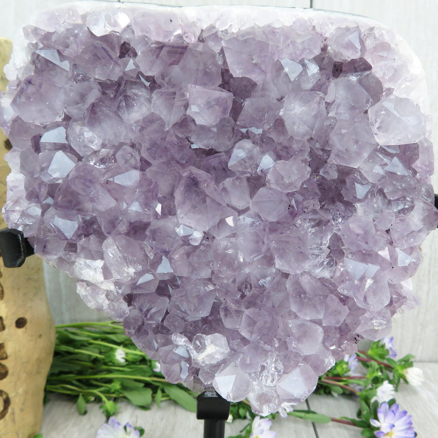 amethyst on stand with decorations in the background