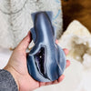 Agate Snowman Crystal Mini-Statue on hand for size reference.