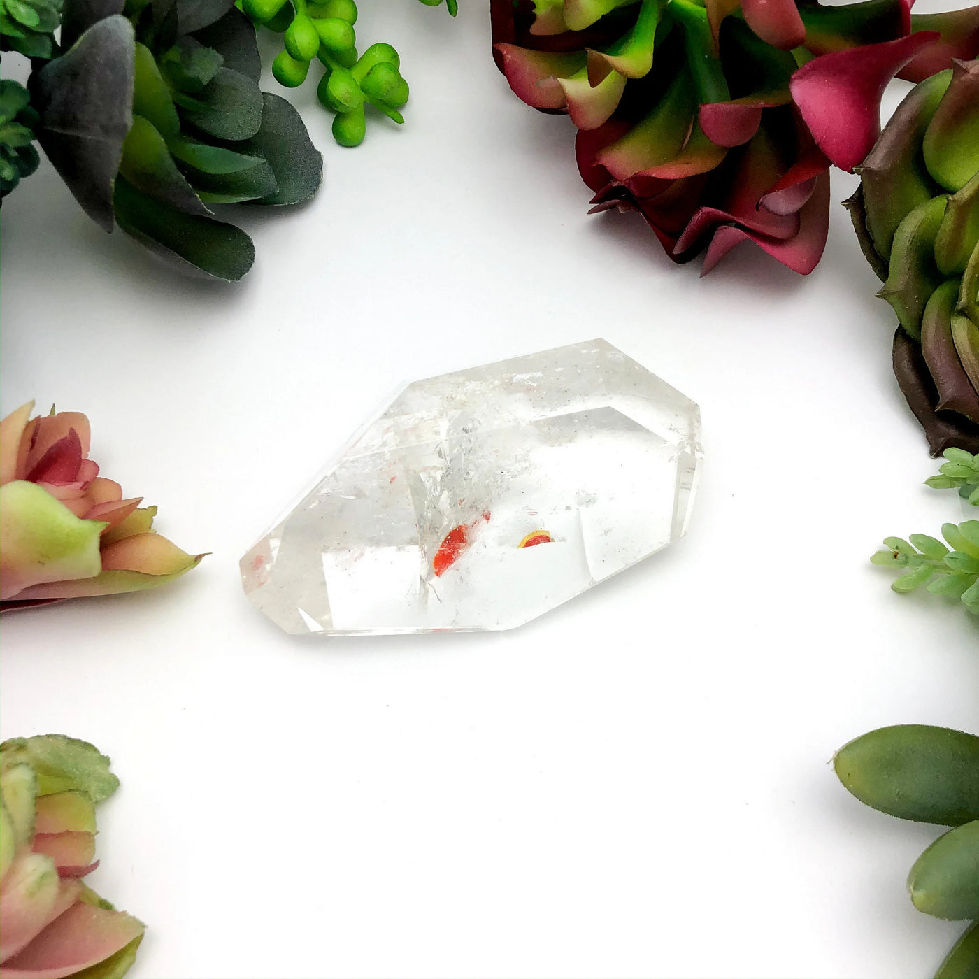 crystal quartz with decorations in the background