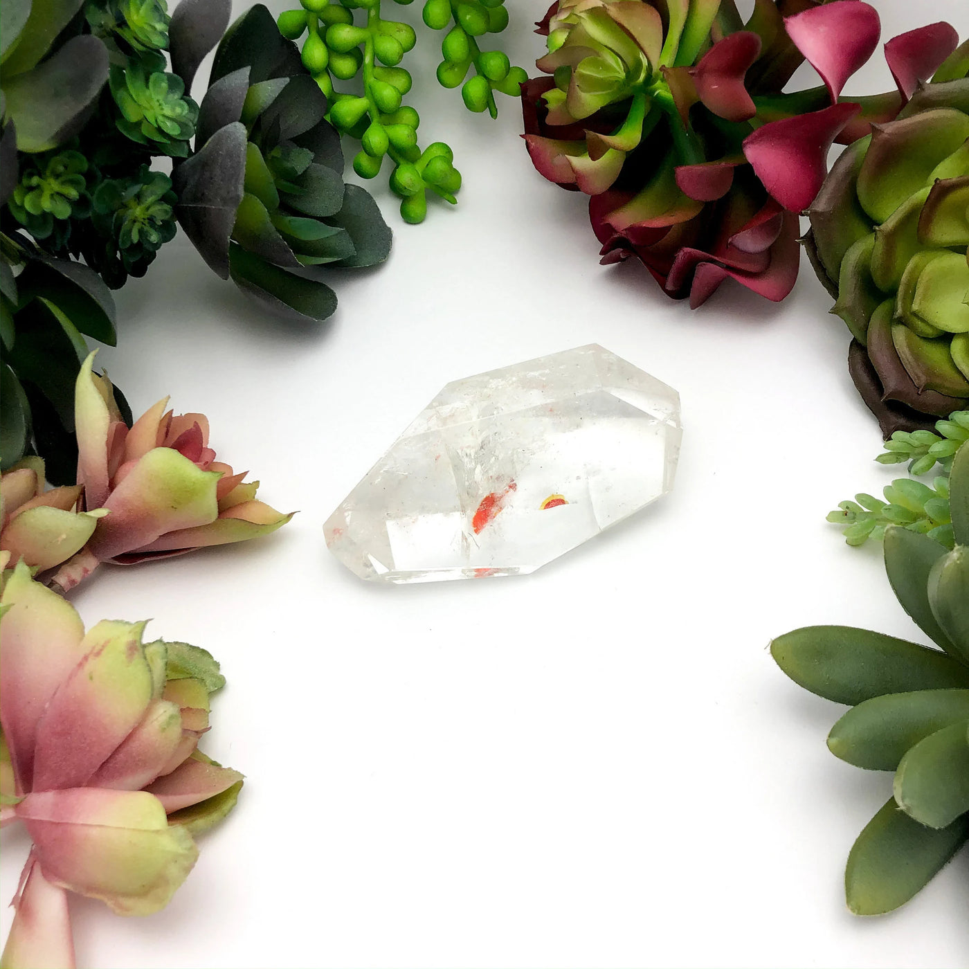 crystal quartz with decorations in the background