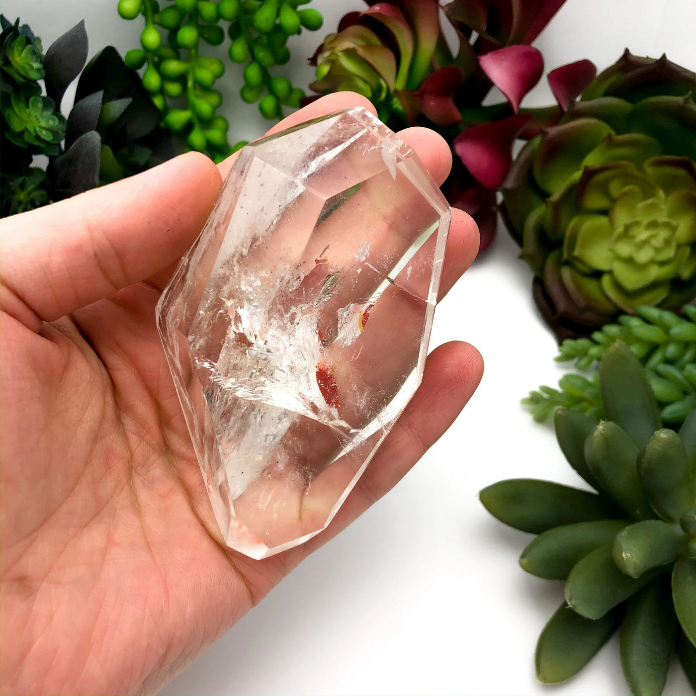 crystal quartz with decorations in the background