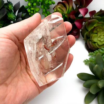 crystal quartz with decorations in the background