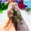 Seven Mineral Semi Polished Crystal Stone on hand for reference.