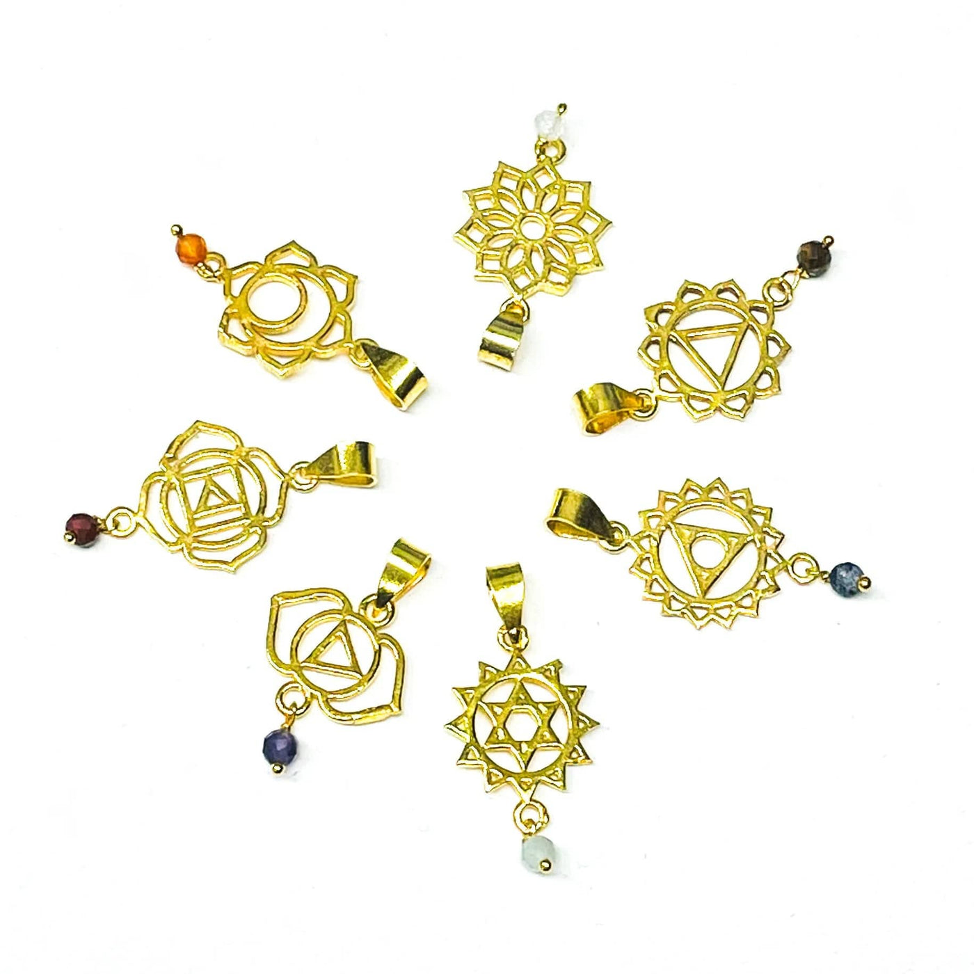 close up of the chakra pendants in gold 
