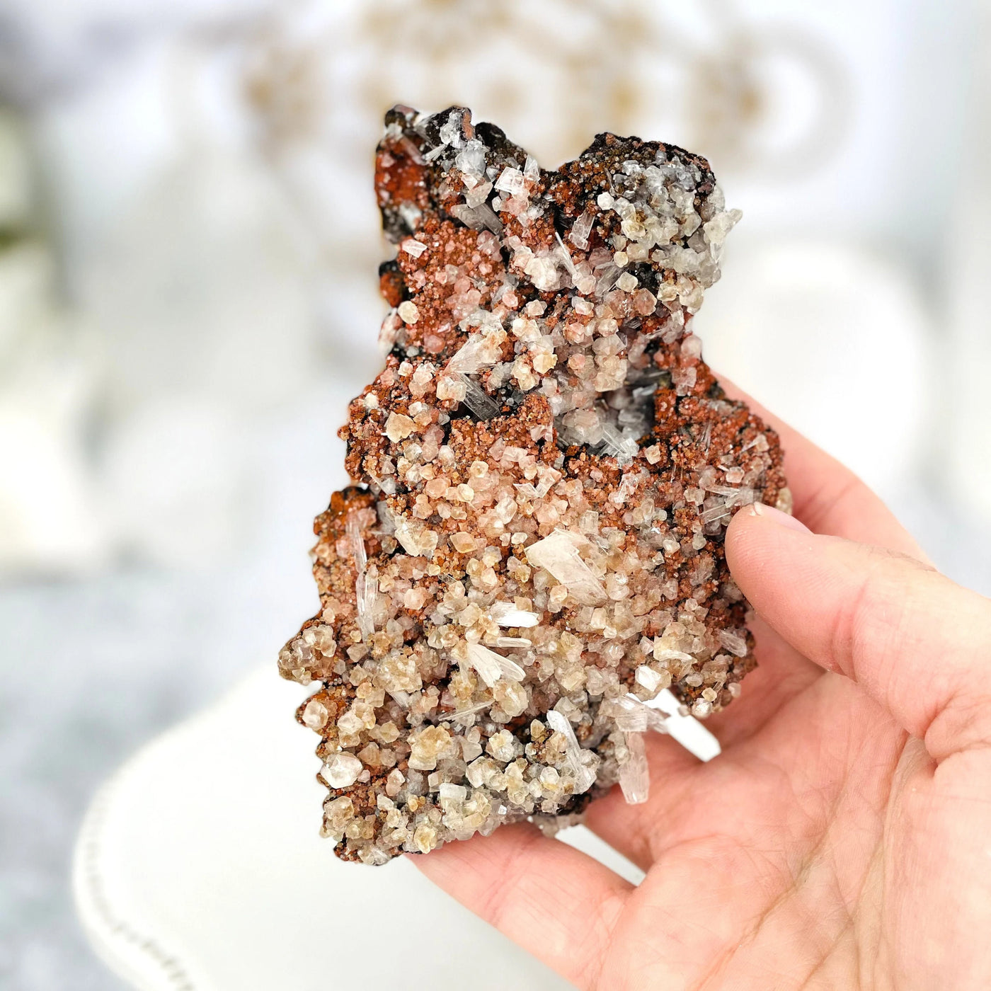 hemimorphite with decorations in the background