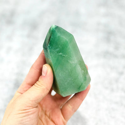 Green Aventurine Point  in a hand for size reference