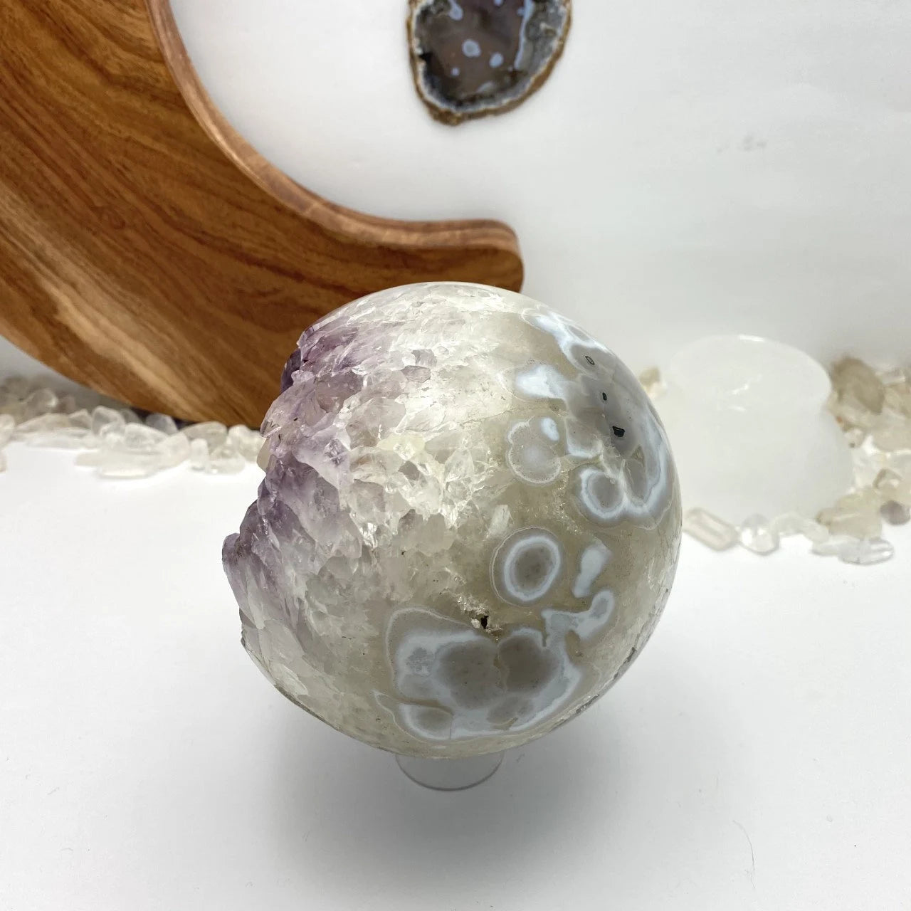 amethyst sphere with decorations in the background