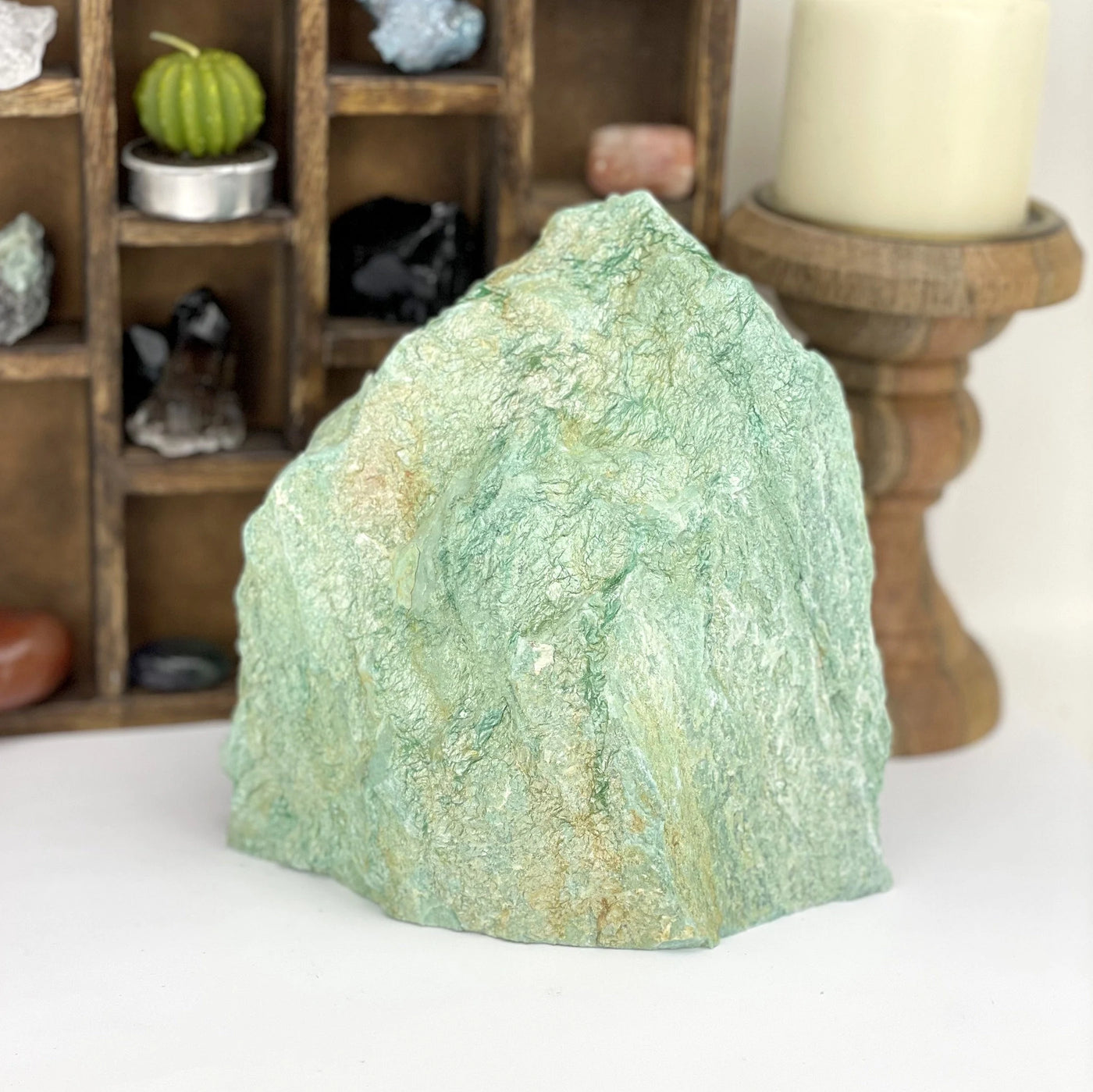 fuchsite with decorations in the background