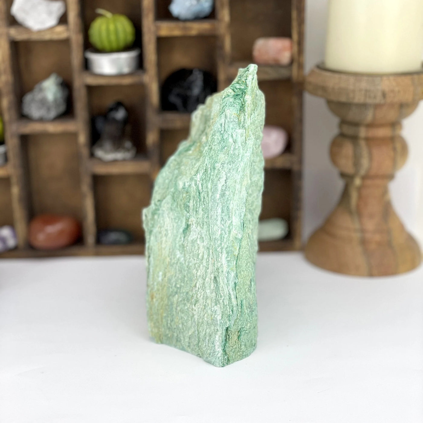 fuchsite with decorations in the background