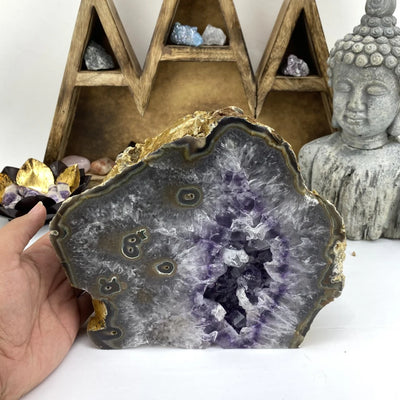 amethyst cut base with decorations in the background