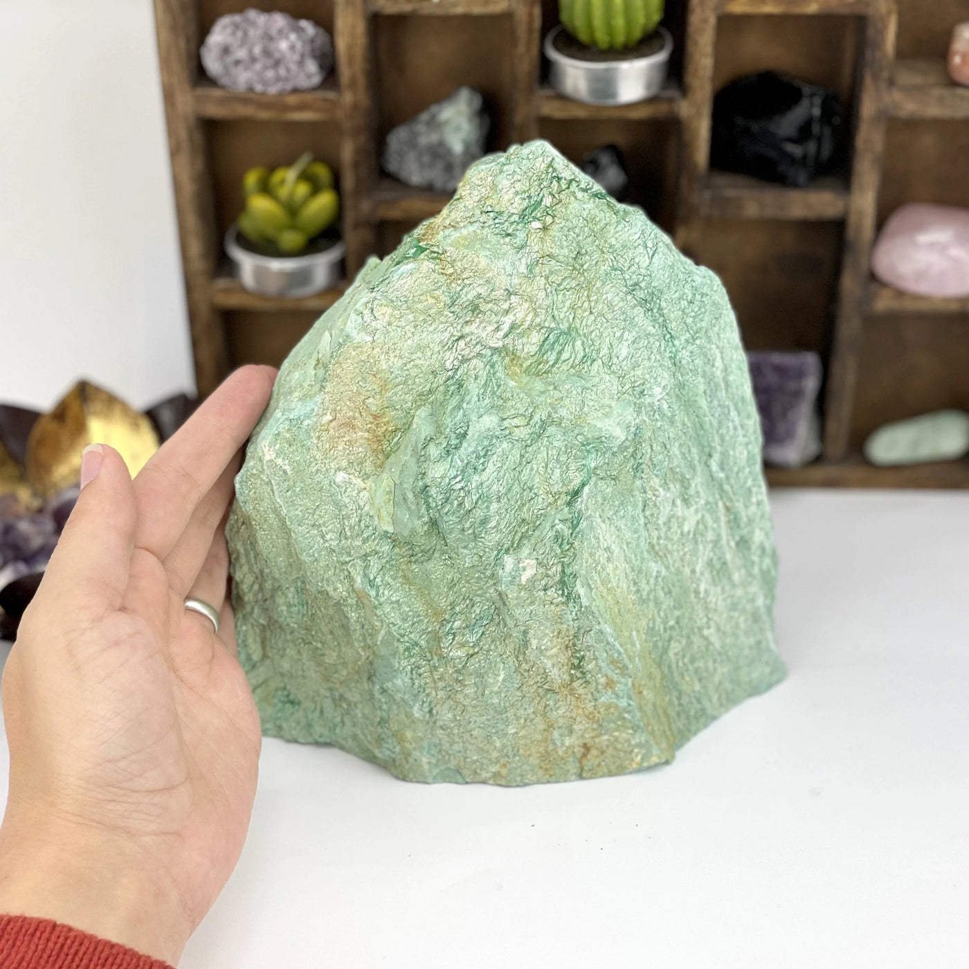 fuchsite with decorations in the background