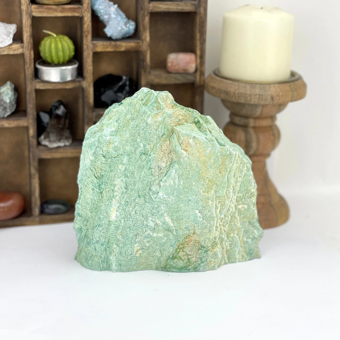 fuchsite with decorations in the background