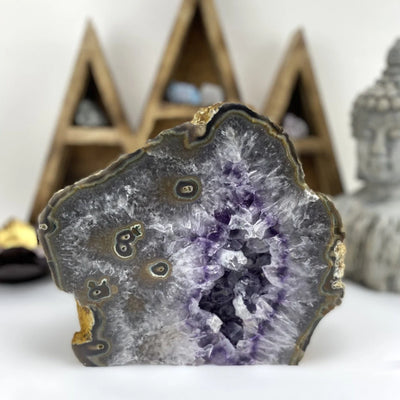 amethyst cut base with decorations in the background