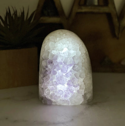 amethyst lamp with decorations in the background