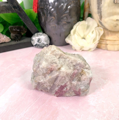 tourmaline with decorations in the background