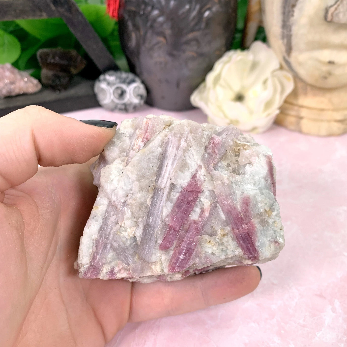 tourmaline with decorations in the background