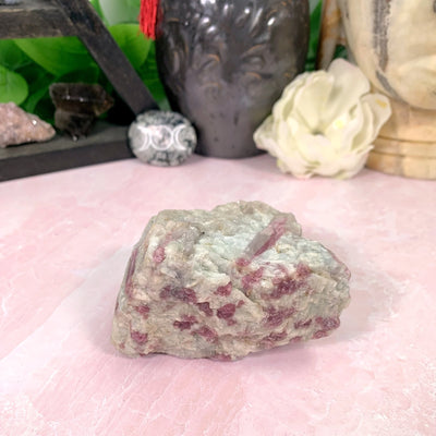 tourmaline with decorations in the background