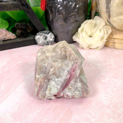 tourmaline with decorations in the background