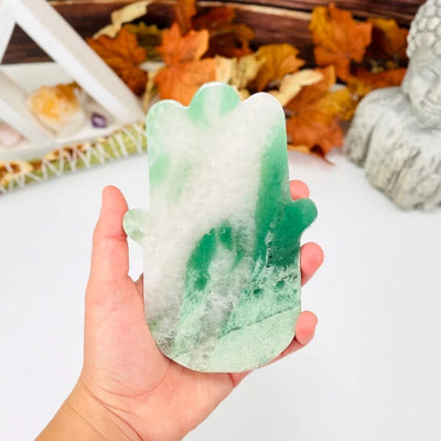 Green and White Quartz Hamsa Hand Stone Slice in a hand for size reference