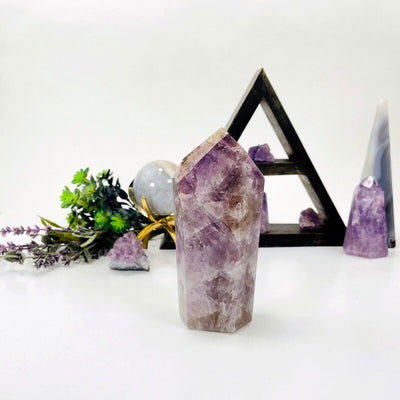 amethyst point with decorations in the background