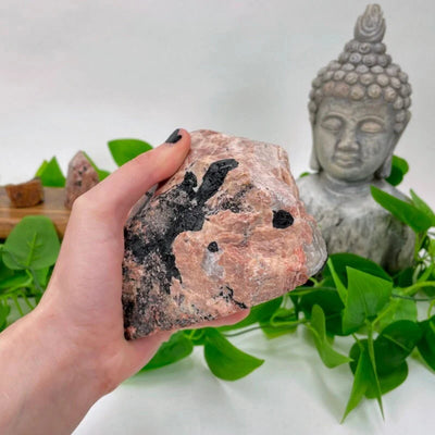 feldspar with decorations in the background