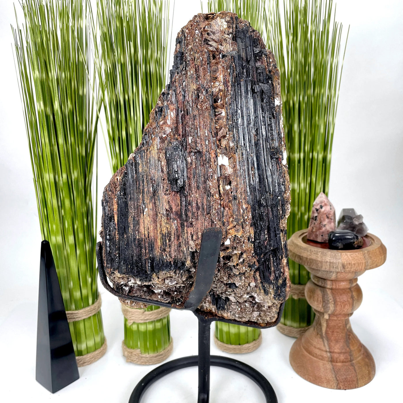 tourmaline on stand with decorations in the background