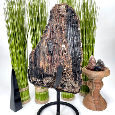 tourmaline on stand with decorations in the background