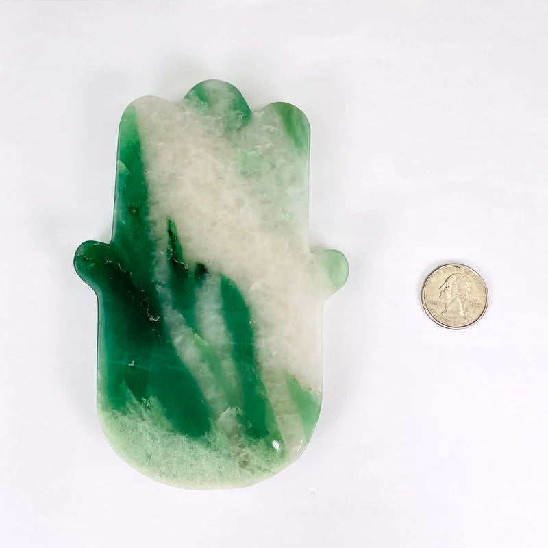 Green and White Quartz Hamsa Hand Stone Slice next to a coin for size reference