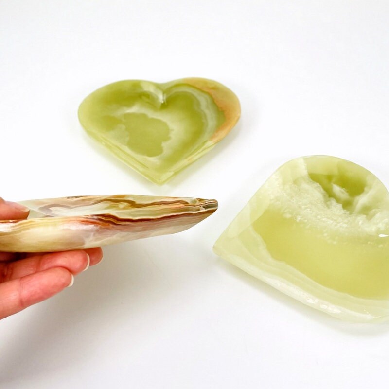 Green Mexican Onyx Heart Bowls, with one shown from the side showing its thickness